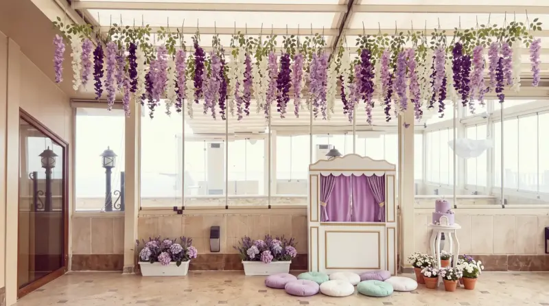 Fairy Tale concept for a children's birthday: puppet stage and cake on the terrace