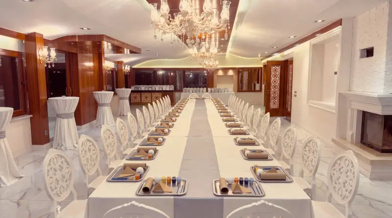 Space concept for a children's birthday: view from the farthest corner of the hall to the buffet end