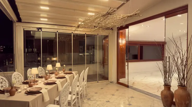 Walnut concept for an adult birthday: branch ceiling and glass door on the terrace
