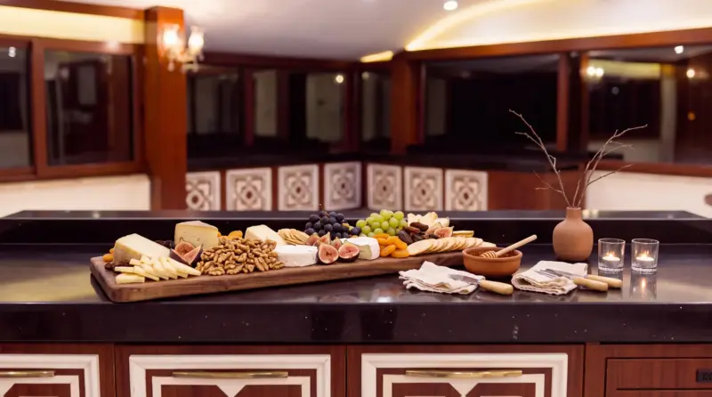 Walnut concept for an adult birthday: close-up of cheese and walnuts on the L-shaped counter