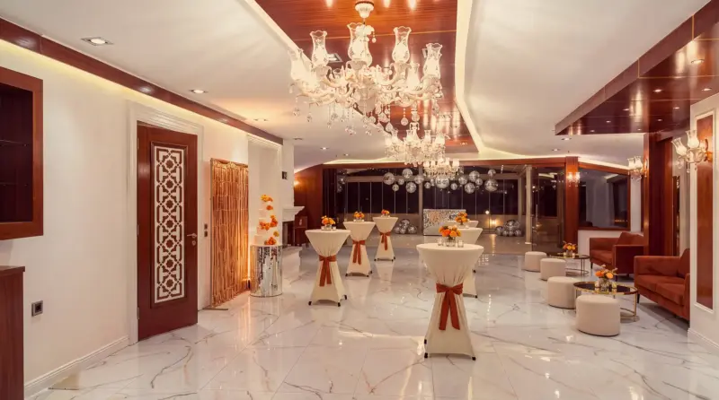 Disco concept for an adult birthday: overall view of hall and terrace from the farthest corner