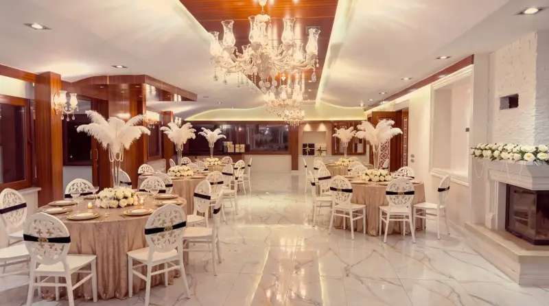 Champagne concept for an adult birthday: view from the fireplace corner to the buffet end